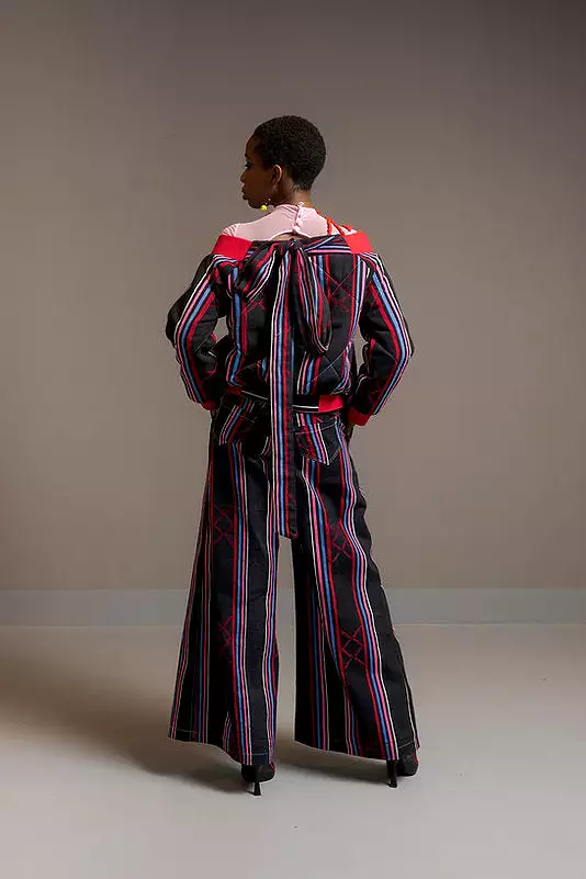 Kardascian- off-Shoulder kilted Bomber Jacket in Kente