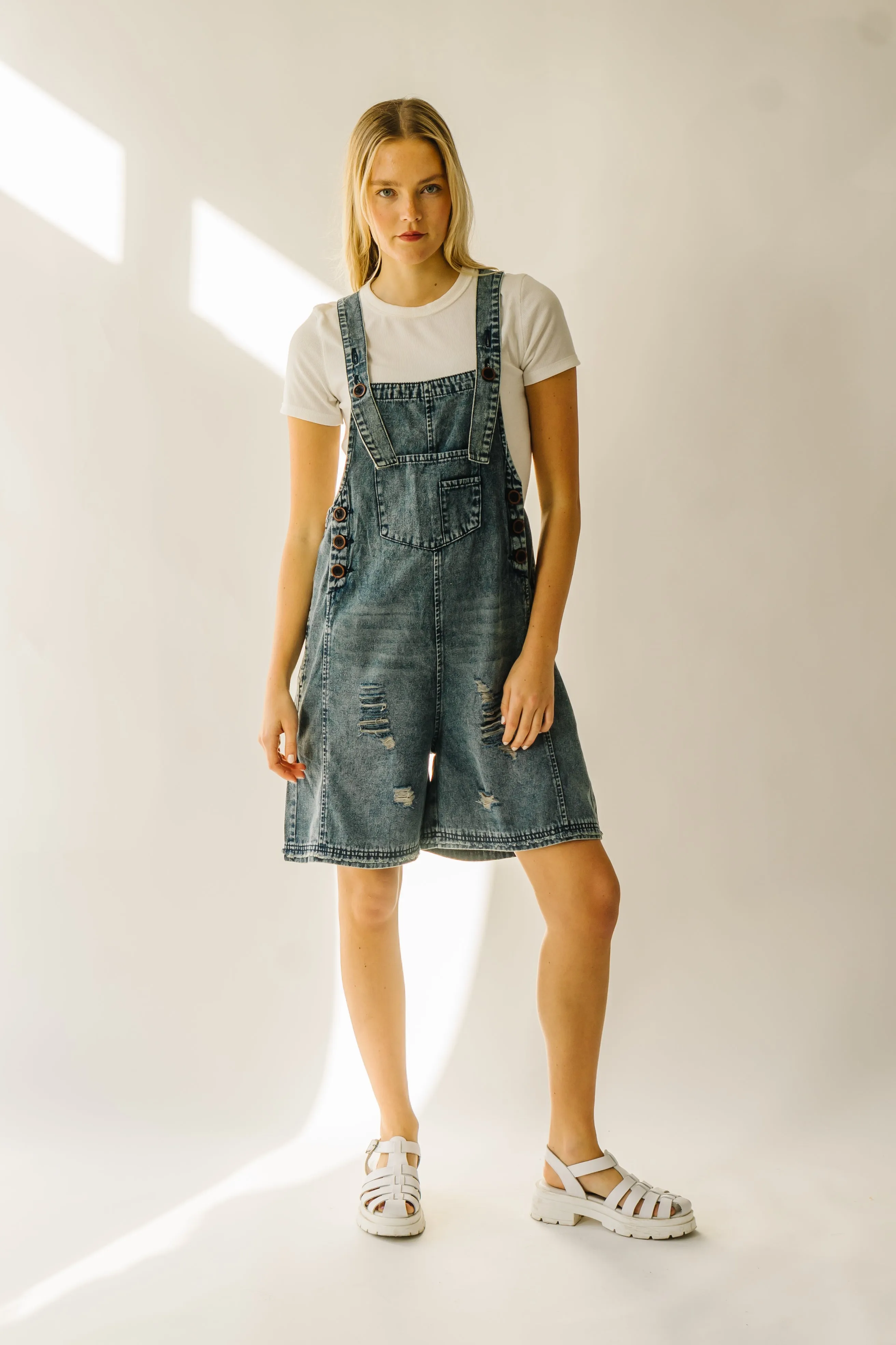 The Dearing Washed Denim Shorts Romper in Vintage Denim