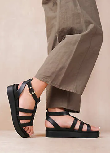 Where’s That From Dubai Extra Wide Fit Mid Platform Gladiator Strap Sandals in Black PU | Kaleidoscope