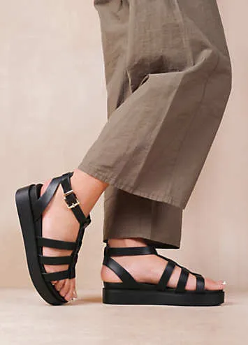 Where’s That From Dubai Wide Fit Mid Platform Gladiator Strap Sandals in Black PU | Kaleidoscope